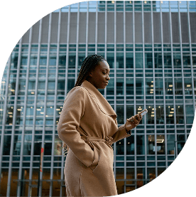 A female IDP counsellor can be seen walking while using her phone